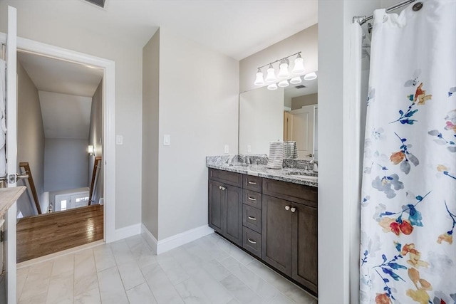 637 Gifford St Unit 4A, Falmouth, MA 02540 - full bath with double vanity and marble finish flooring