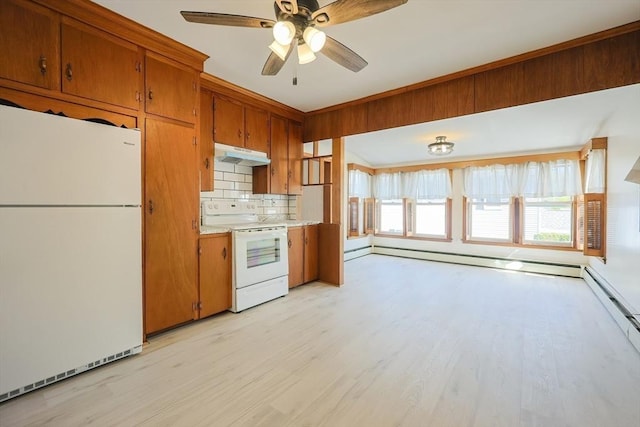 kitchen featuring white appliances, under cabinet range hood, brown cabinetry, and light wood-style floors