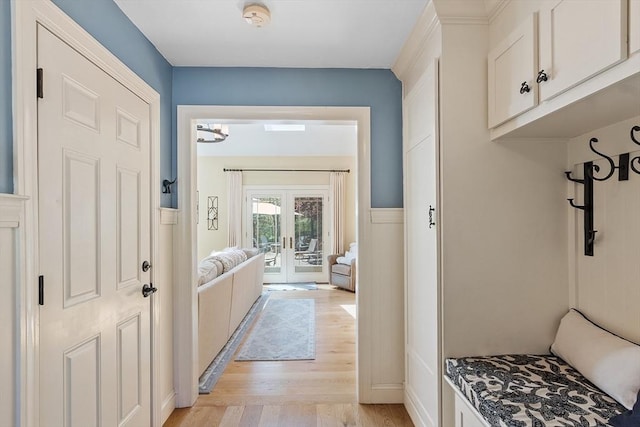 mudroom featuring french doors and light wood-type flooring