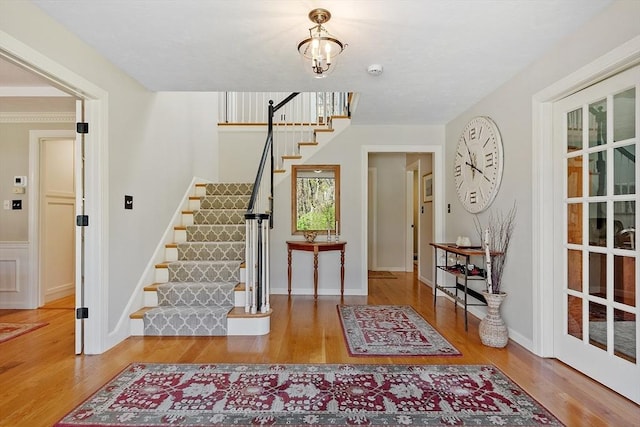 entryway with stairs and wood finished floors