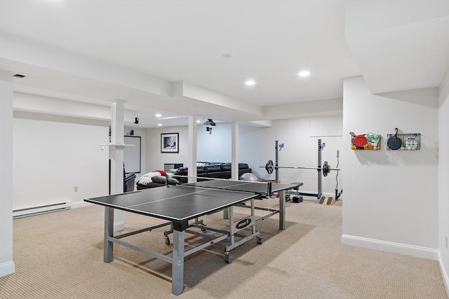 recreation room featuring baseboards, a baseboard radiator, and light carpet