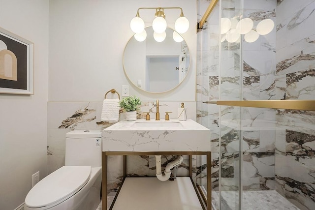 bathroom with toilet, an enclosed shower, sink, and tile walls