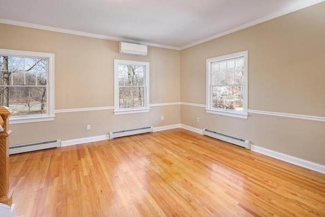 spare room with baseboard heating, a healthy amount of sunlight, and a wall mounted air conditioner