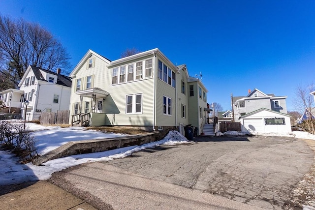 view of front of home with fence and a residential view