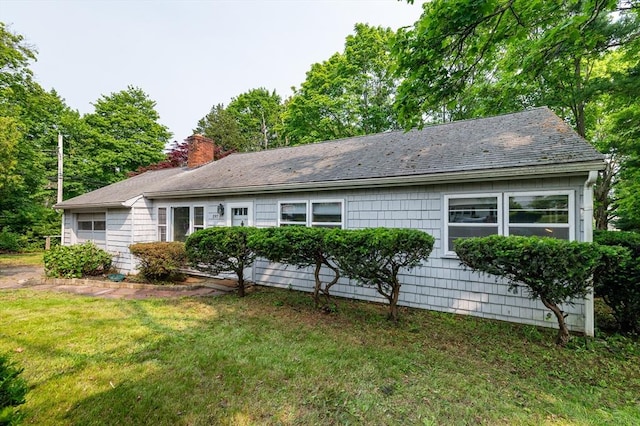 397 Elm St, Braintree, MA 02184 - view of property exterior featuring a chimney and a yard