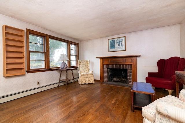 397 Elm St, Braintree, MA 02184 - living area featuring wood finished floors, baseboard heating, and a fireplace
