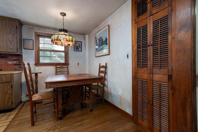 397 Elm St, Braintree, MA 02184 - dining area featuring light wood-type flooring and baseboards