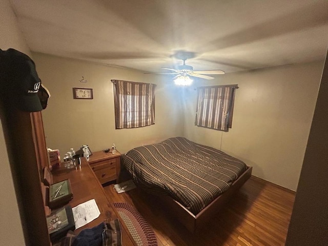 bedroom featuring a ceiling fan and wood finished floors