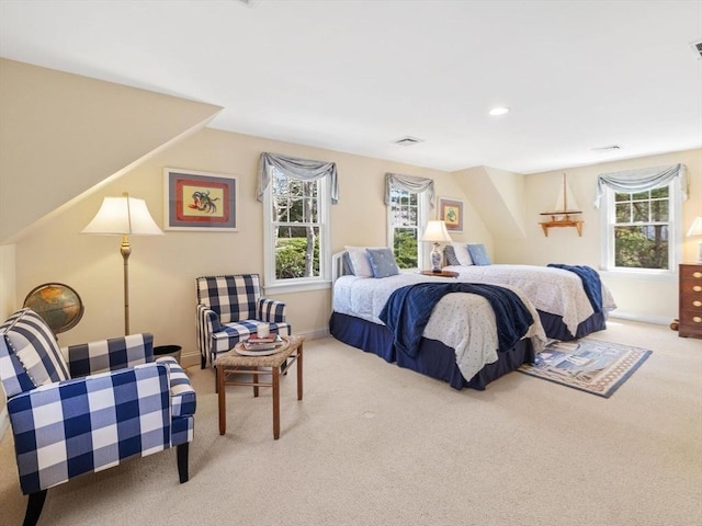 carpeted bedroom with multiple windows and baseboards
