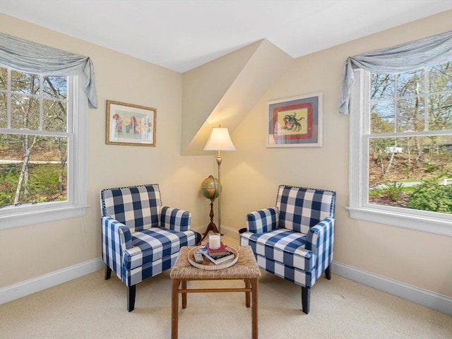 sitting room featuring carpet and baseboards