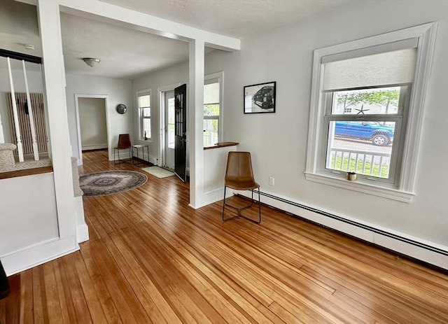 1 S Ave Unit 1, Hull, MA 02045 - foyer featuring a baseboard heating unit, healthy amount of natural light, and wood finished floors