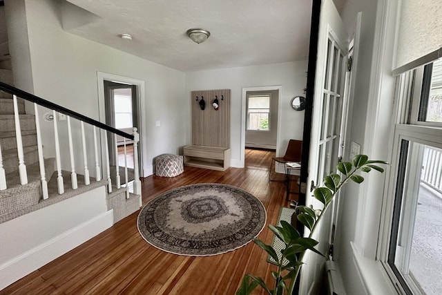 1 S Ave Unit 1, Hull, MA 02045 - entrance foyer with wood finished floors, stairway, and a baseboard radiator
