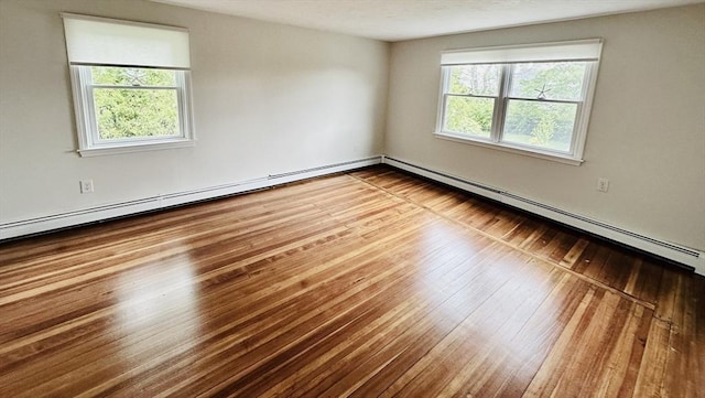 1 S Ave Unit 1, Hull, MA 02045 - unfurnished room with a baseboard heating unit and wood-type flooring
