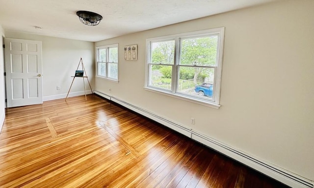 1 S Ave Unit 1, Hull, MA 02045 - unfurnished room with a baseboard radiator and light wood-style floors