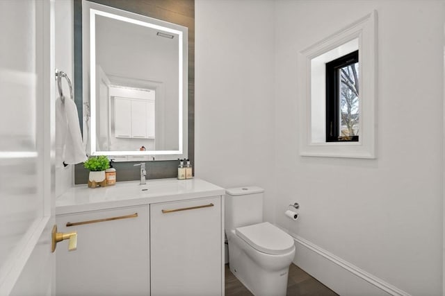 bathroom featuring vanity and toilet