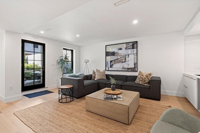 living room with light hardwood / wood-style floors