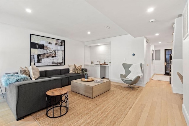 living room with light hardwood / wood-style floors