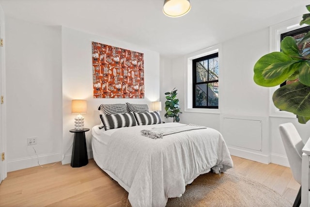 bedroom featuring wood-type flooring