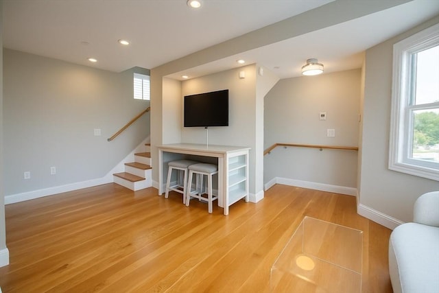 89 Prescott St Unit C, Boston, MA 02128 - living area with wood finished floors, recessed lighting, plenty of natural light, and stairway