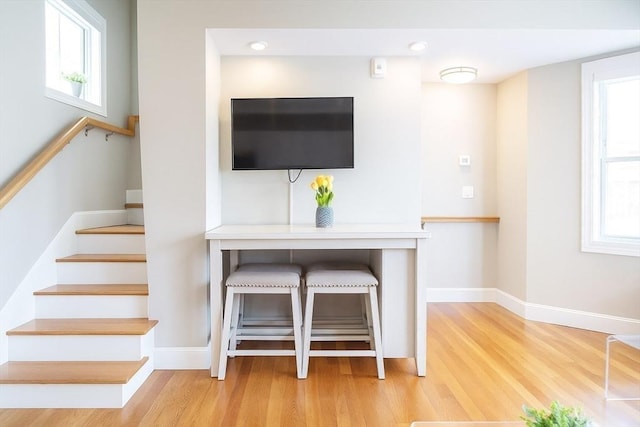 89 Prescott St Unit C, Boston, MA 02128 - living room featuring wood finished floors, healthy amount of natural light, and stairway