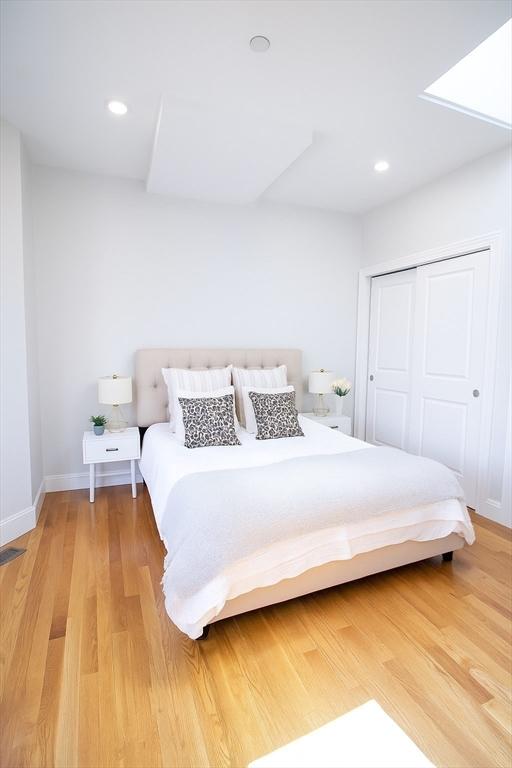 89 Prescott St Unit C, Boston, MA 02128 - bedroom with a closet, light wood-style floors, and recessed lighting