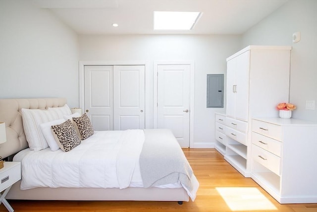 89 Prescott St Unit C, Boston, MA 02128 - bedroom featuring electric panel, light wood-style floors, and recessed lighting