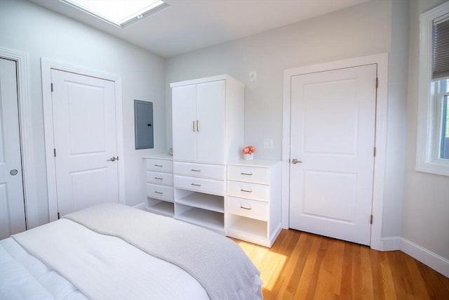 89 Prescott St Unit C, Boston, MA 02128 - bedroom with electric panel and light wood-type flooring
