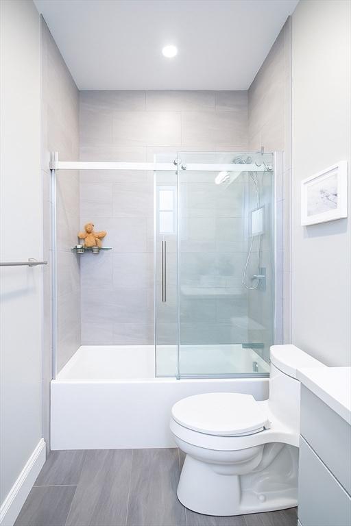 89 Prescott St Unit C, Boston, MA 02128 - bathroom with vanity and bath / shower combo with glass door