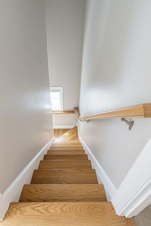89 Prescott St Unit C, Boston, MA 02128 - stairway featuring baseboards and wood finished floors