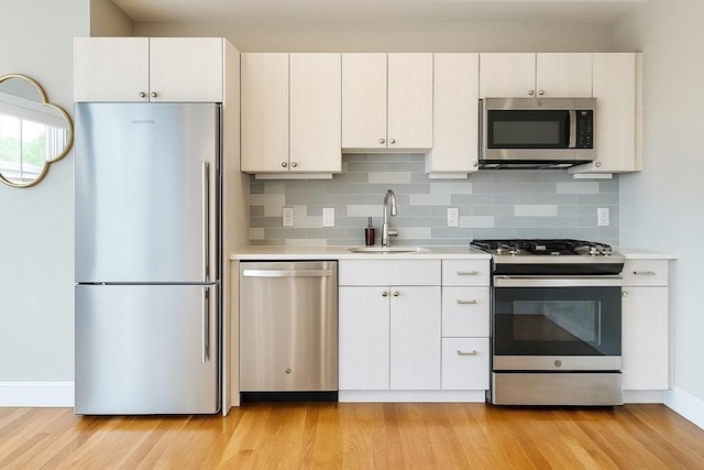 89 Prescott St Unit C, Boston, MA 02128 - kitchen featuring appliances with stainless steel finishes, light countertops, and light wood-type flooring