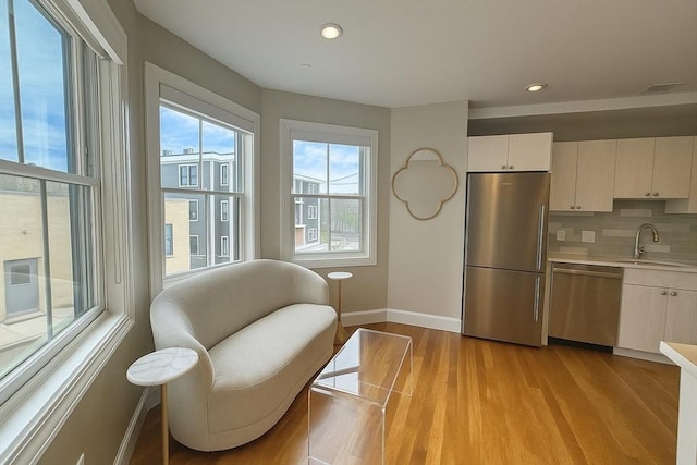 89 Prescott St Unit C, Boston, MA 02128 - living area with plenty of natural light, light wood-type flooring, and recessed lighting