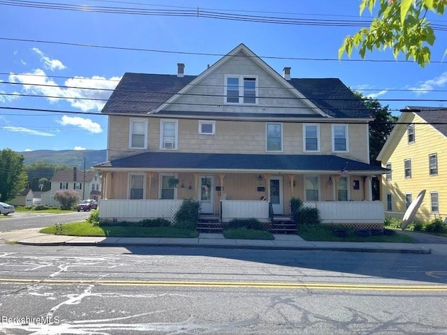 56-58 N Summer St, Adams, MA 01220 - view of front of house with a porch and a chimney