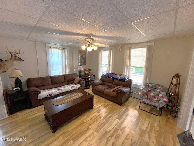 56-58 N Summer St, Adams, MA 01220 - living area with a drop ceiling, a baseboard heating unit, light wood finished floors, and ceiling fan