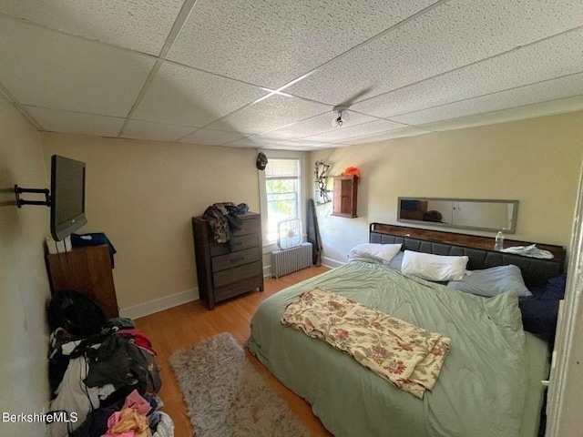 56-58 N Summer St, Adams, MA 01220 - bedroom featuring wood finished floors, radiator, a paneled ceiling, and baseboards