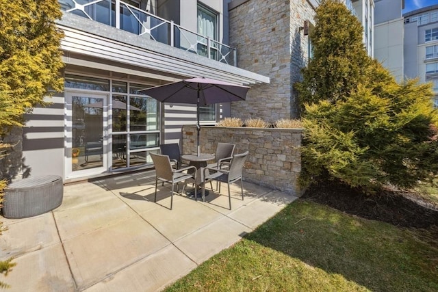 view of patio with a balcony