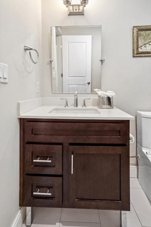 half bathroom featuring toilet and vanity