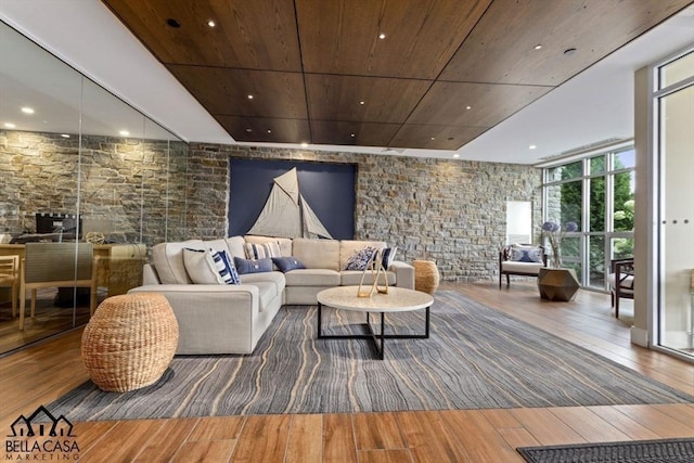 living room with wood ceiling, recessed lighting, hardwood / wood-style flooring, and expansive windows