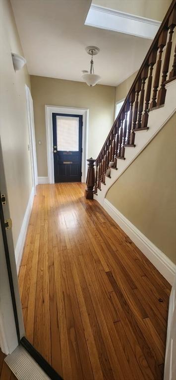 foyer with wood-type flooring