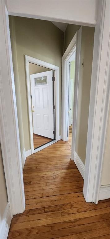 hall with light hardwood / wood-style flooring