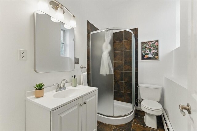 69 Harvey St Unit 1, Cambridge, MA 02140 - bathroom with baseboard heating, toilet, vanity, and a stall shower