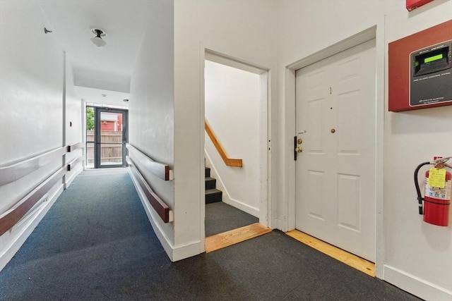 69 Harvey St Unit 1, Cambridge, MA 02140 - foyer featuring stairway and baseboards