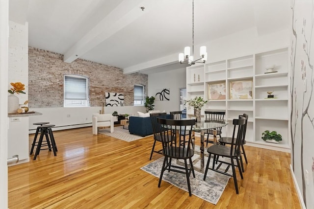 69 Harvey St Unit 1, Cambridge, MA 02140 - dining area featuring wood finished floors, a chandelier, and beam ceiling