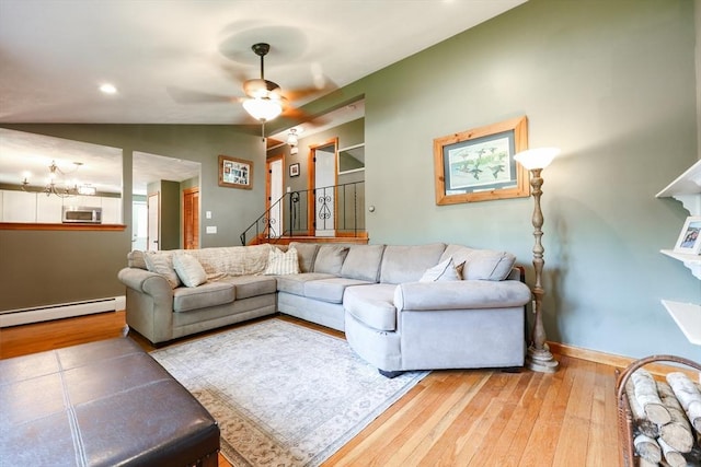 68 Partridge Dr, Brockton, MA 02301 - living area with a baseboard heating unit, light wood finished floors, vaulted ceiling, and ceiling fan