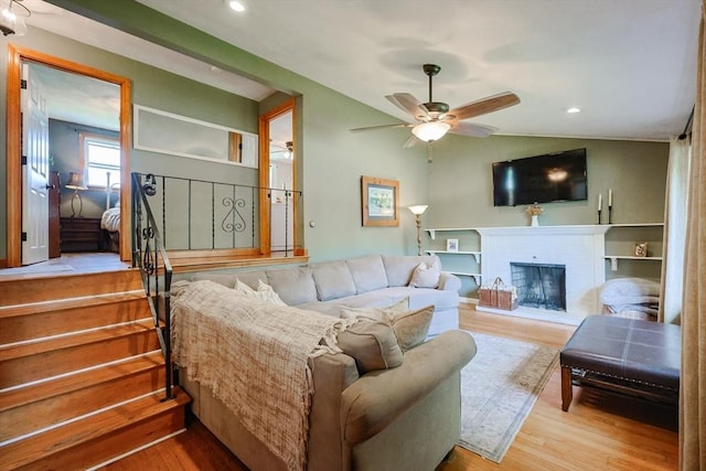 68 Partridge Dr, Brockton, MA 02301 - living room featuring wood finished floors, ceiling fan, a brick fireplace, and recessed lighting