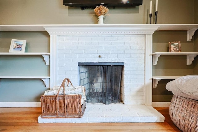 68 Partridge Dr, Brockton, MA 02301 - detailed view of wood finished floors and a fireplace