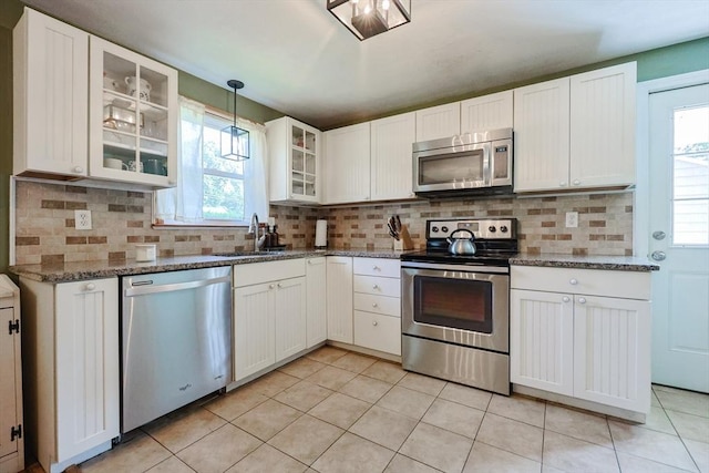 68 Partridge Dr, Brockton, MA 02301 - kitchen with appliances with stainless steel finishes, white cabinets, stone countertops, and tasteful backsplash
