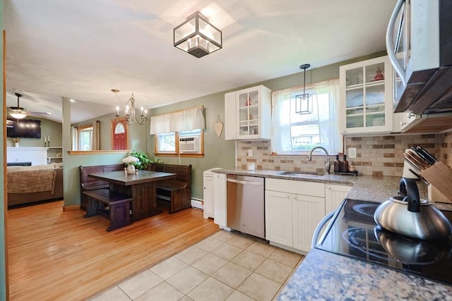 68 Partridge Dr, Brockton, MA 02301 - kitchen featuring white microwave, stainless steel dishwasher, white cabinets, and decorative backsplash