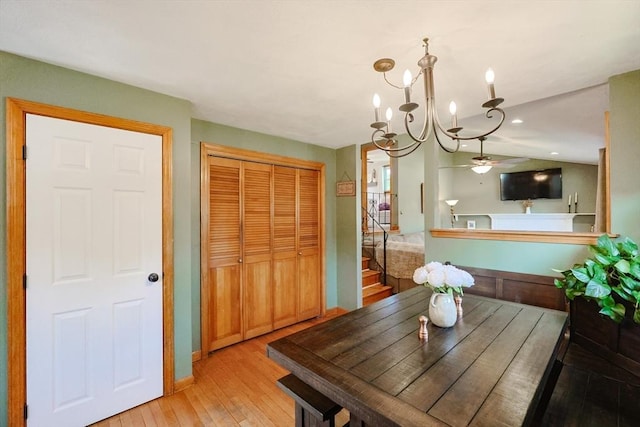 68 Partridge Dr, Brockton, MA 02301 - dining area featuring light wood-style flooring, a chandelier, a ceiling fan, stairs, and vaulted ceiling