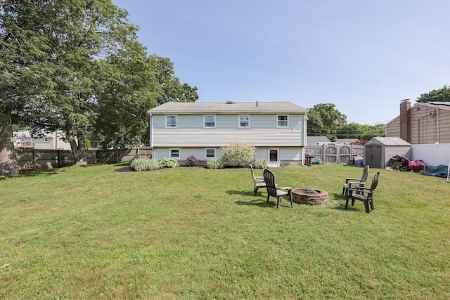 68 Partridge Dr, Brockton, MA 02301 - back of house featuring an outdoor fire pit, a storage shed, and a fenced backyard