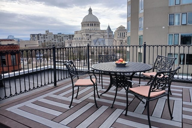 wooden terrace featuring a view of city